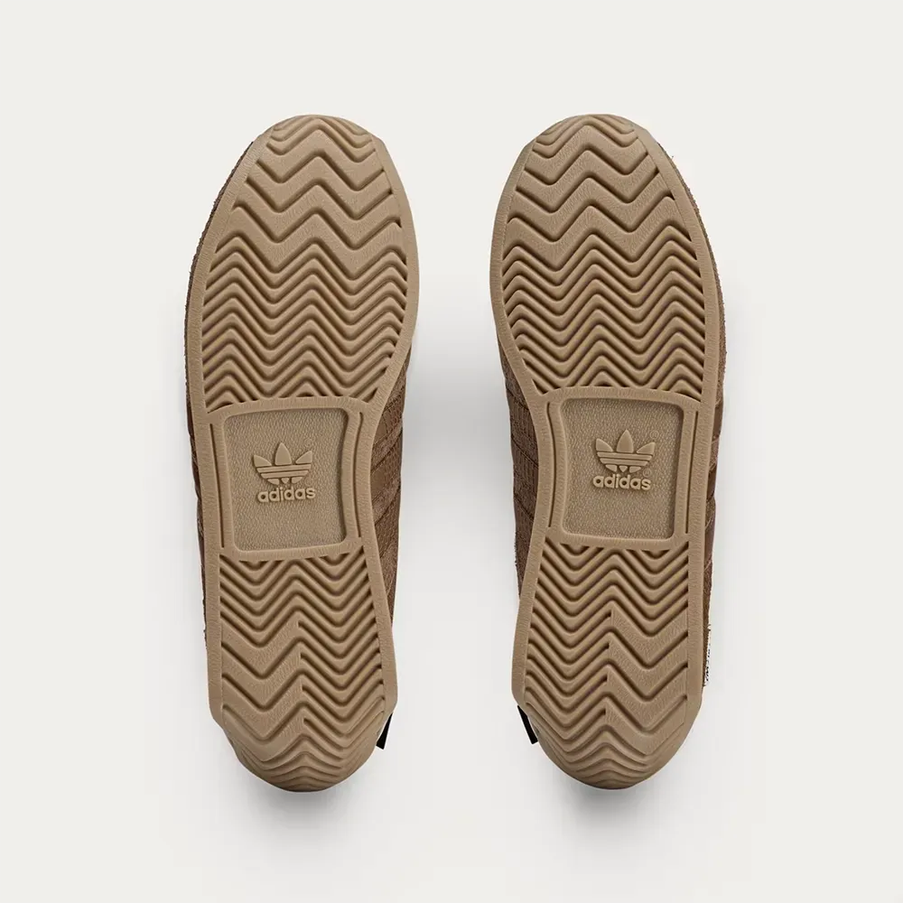 Song For The Mute x adidas Country OG Bronze - Droper