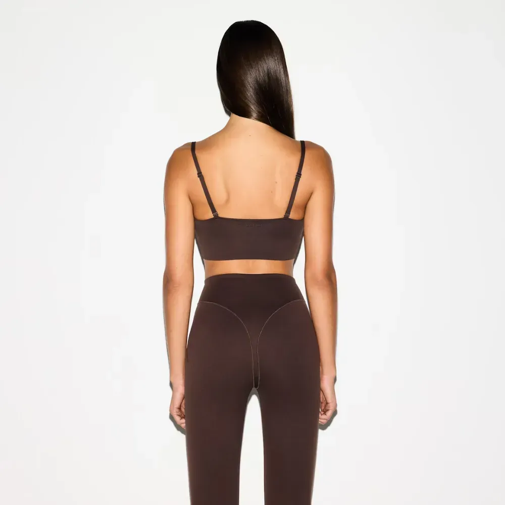 SKIMS x Nike Calça V-Line 26