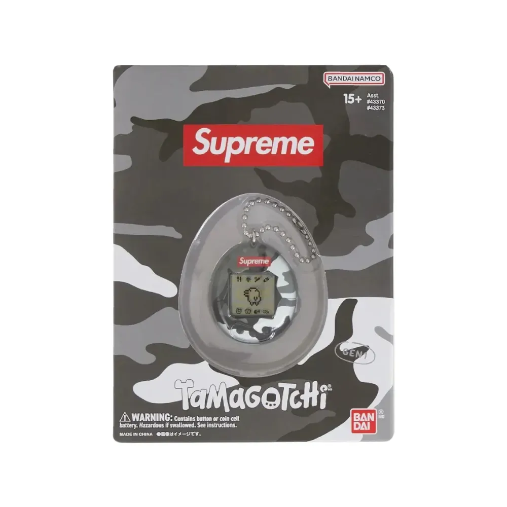 Supreme Tamagotchi カモフラージュ Bandai x Supreme Tamagotchi Camo Pink Yellow Black SS23 - Droper
