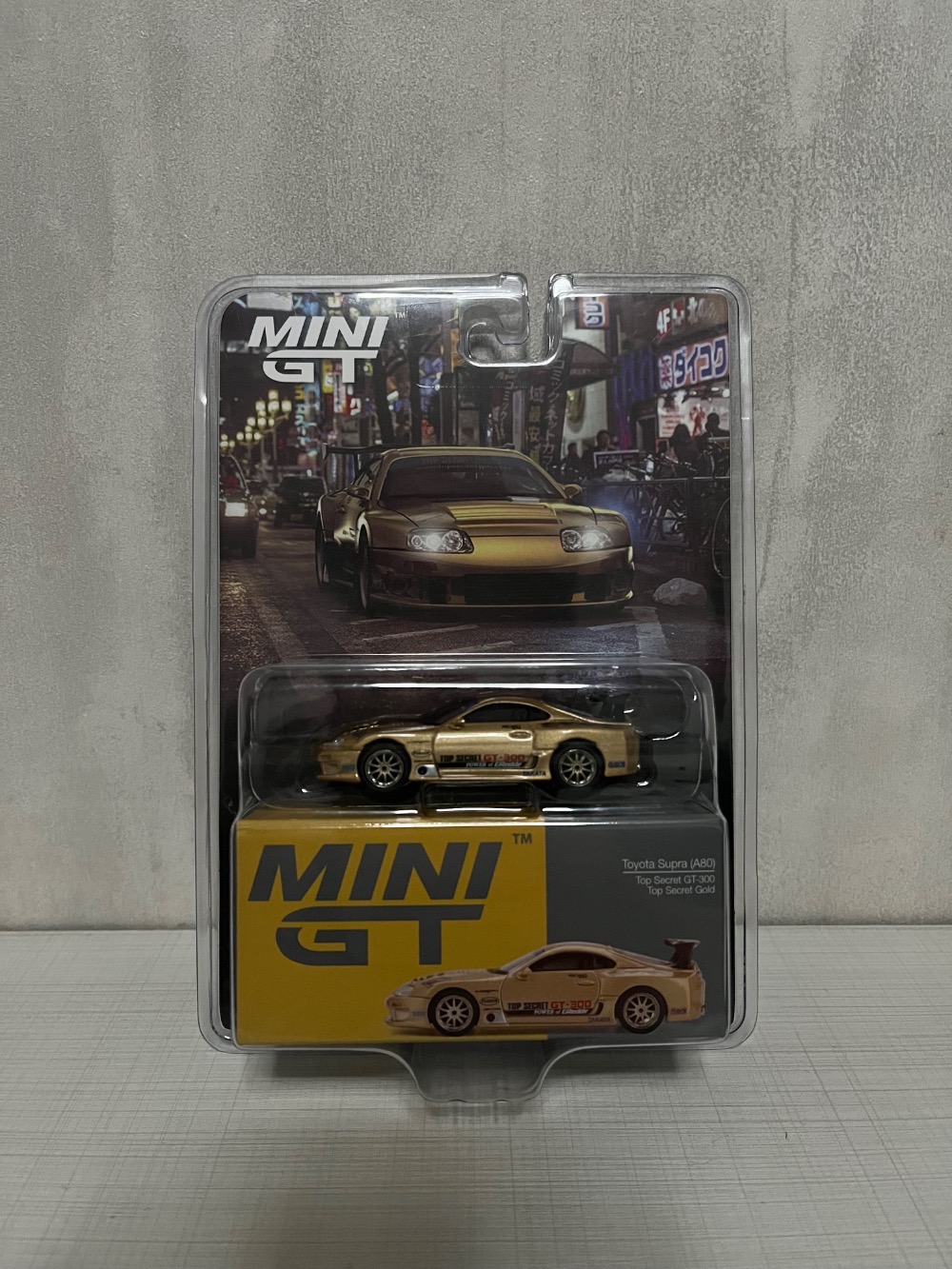 ￼MINI GT - Toyota Supra (A80) Top Secret GT-300 1:64